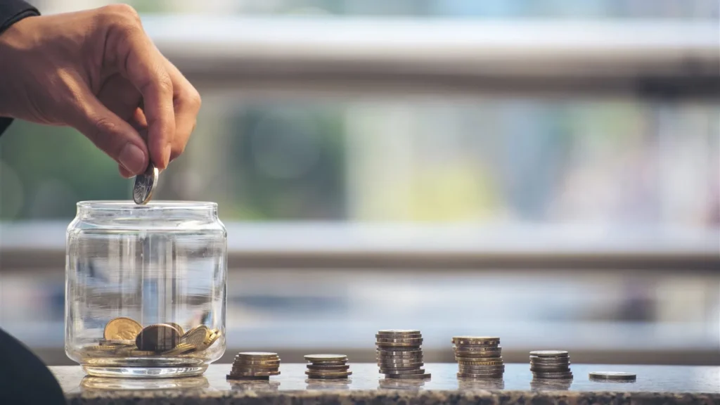 Couple planning a wedding budget at home